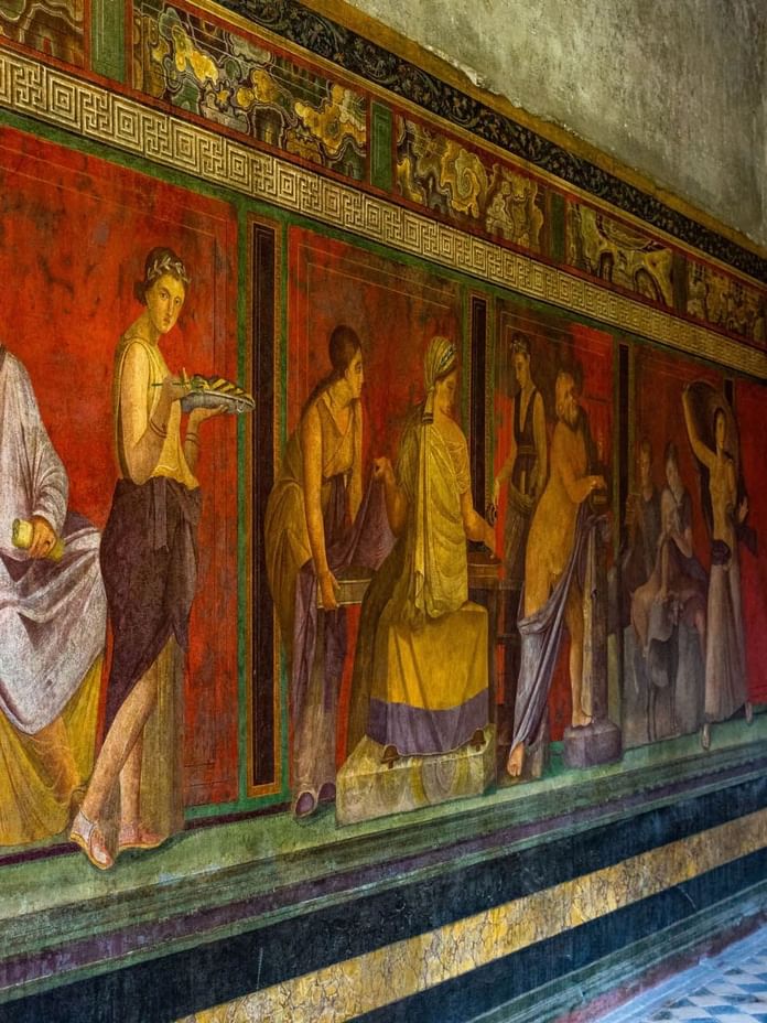 View of paintings on the wall in Villa of the Mysteries near The Independent