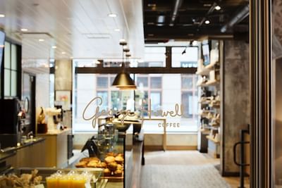 Interior of George Howell Coffee with Logo on Door