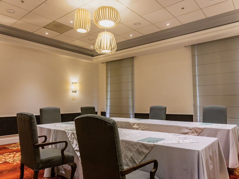 U-shaped table set up in Esmeralda Room at Gamma Hotels