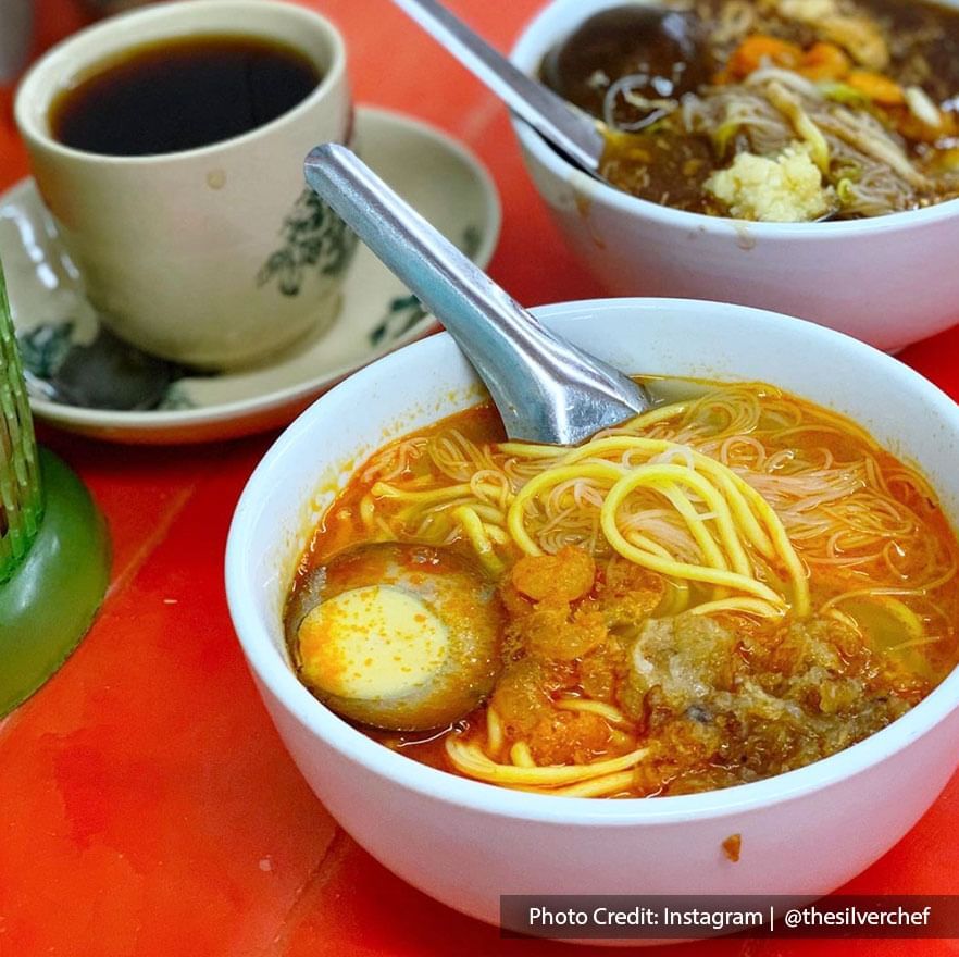 two bowls of hokkien mee with a cup of coffee were served to the customers at Restoran Old Green House Penang