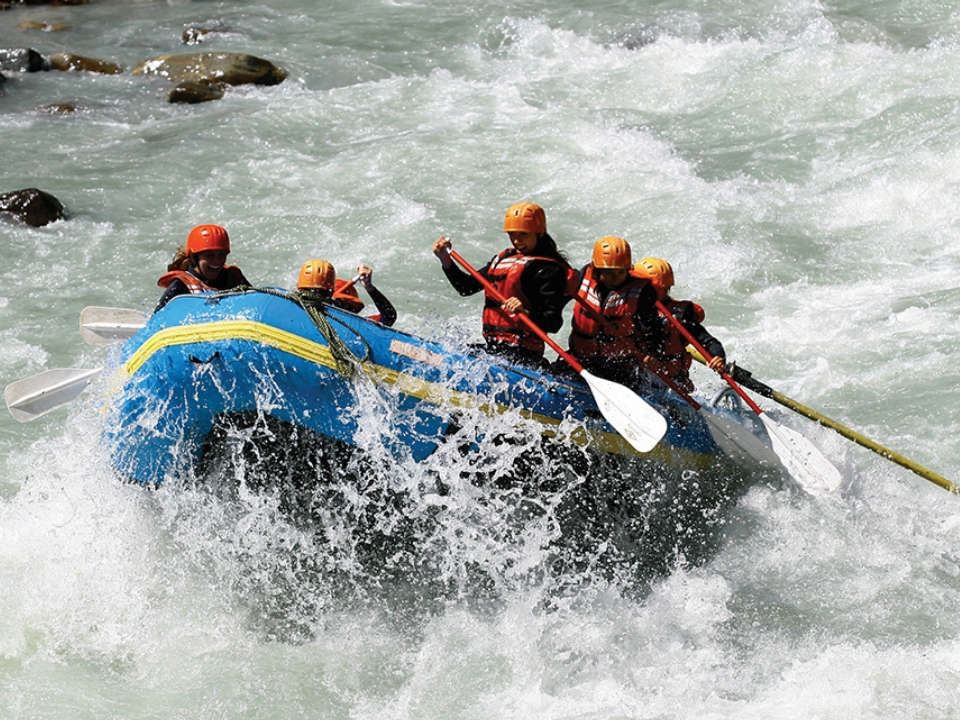 People water rafting on a river near Aava Whistler Hotel
