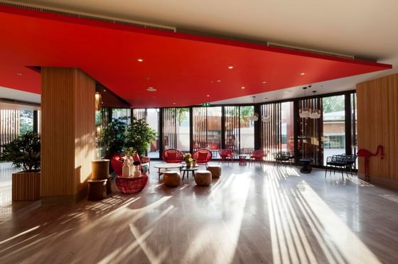 Elegant lobby area with red ceiling and polished wooden floors at Eastin Tan Hotel Chiang Mai