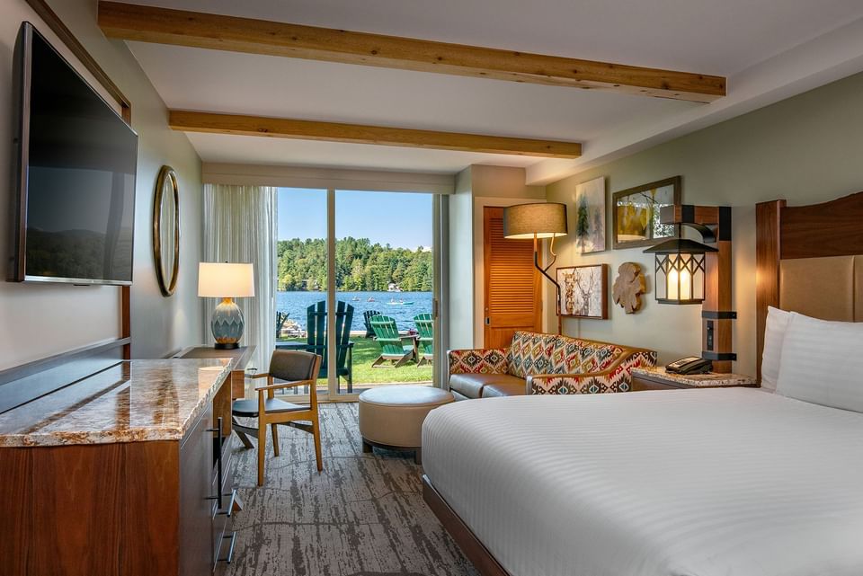 Lake View King with a wooden desk by a patterned sofa under warm lamps at High Peaks Resort