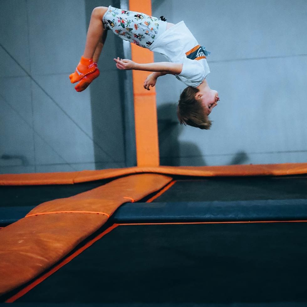 A child jumping on an indoor trampoline at Falkensteiner Hotel Prague