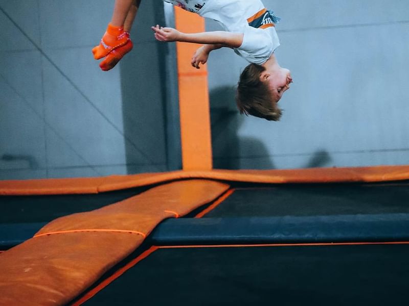 A kid performing gymnastic exercises, Falkensteiner Hotels