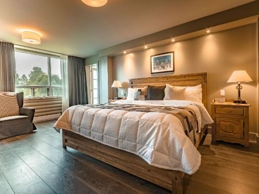 Bed & furniture in Marquise Suite at Mont Gabriel Resort & Spa