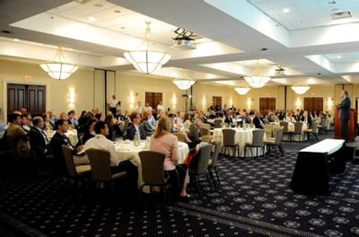 Portrait of guests at a conference held at UMass Lowell Inn