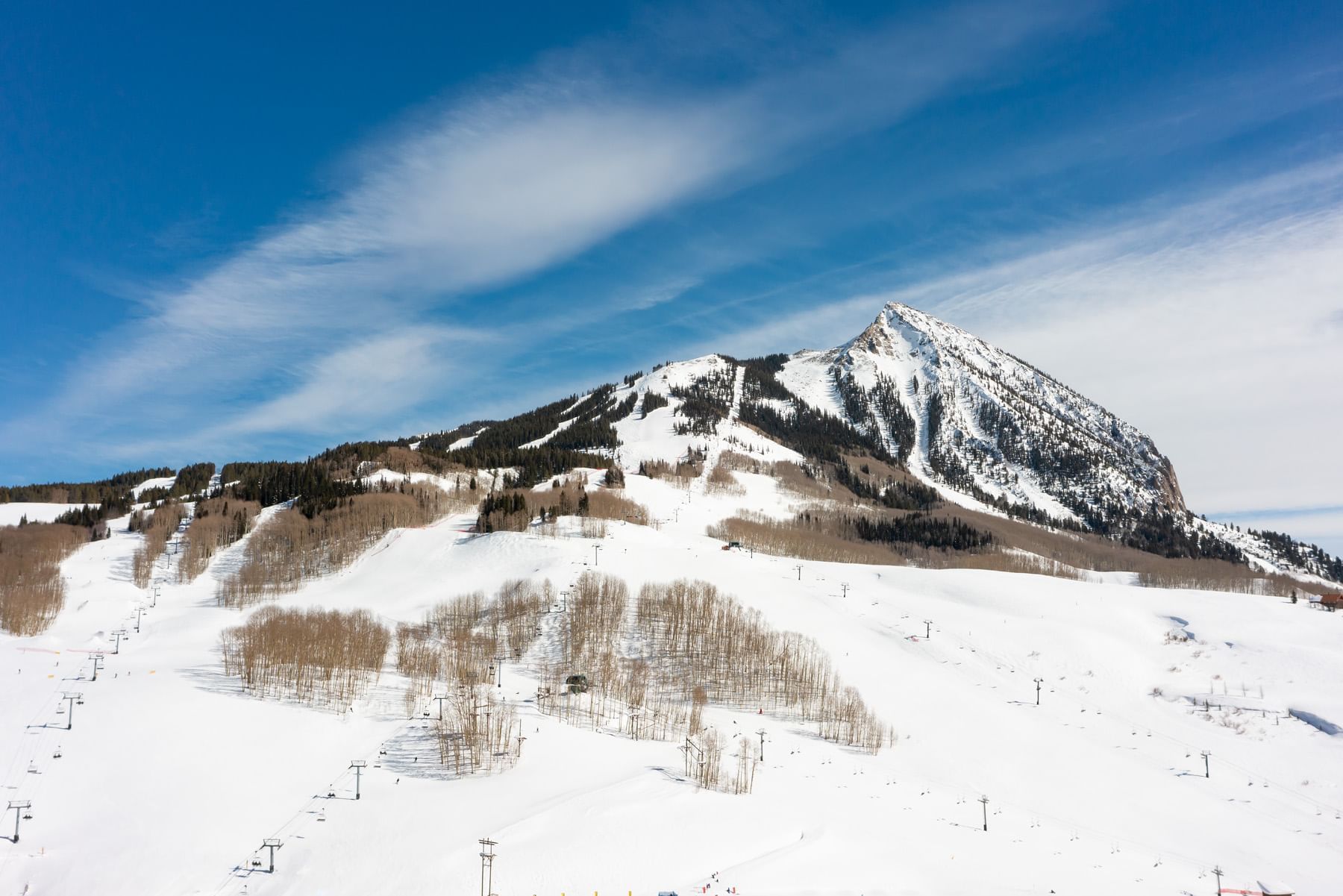 Snowy mountain slope with ski lift and trees at Elevation Resort & Spa