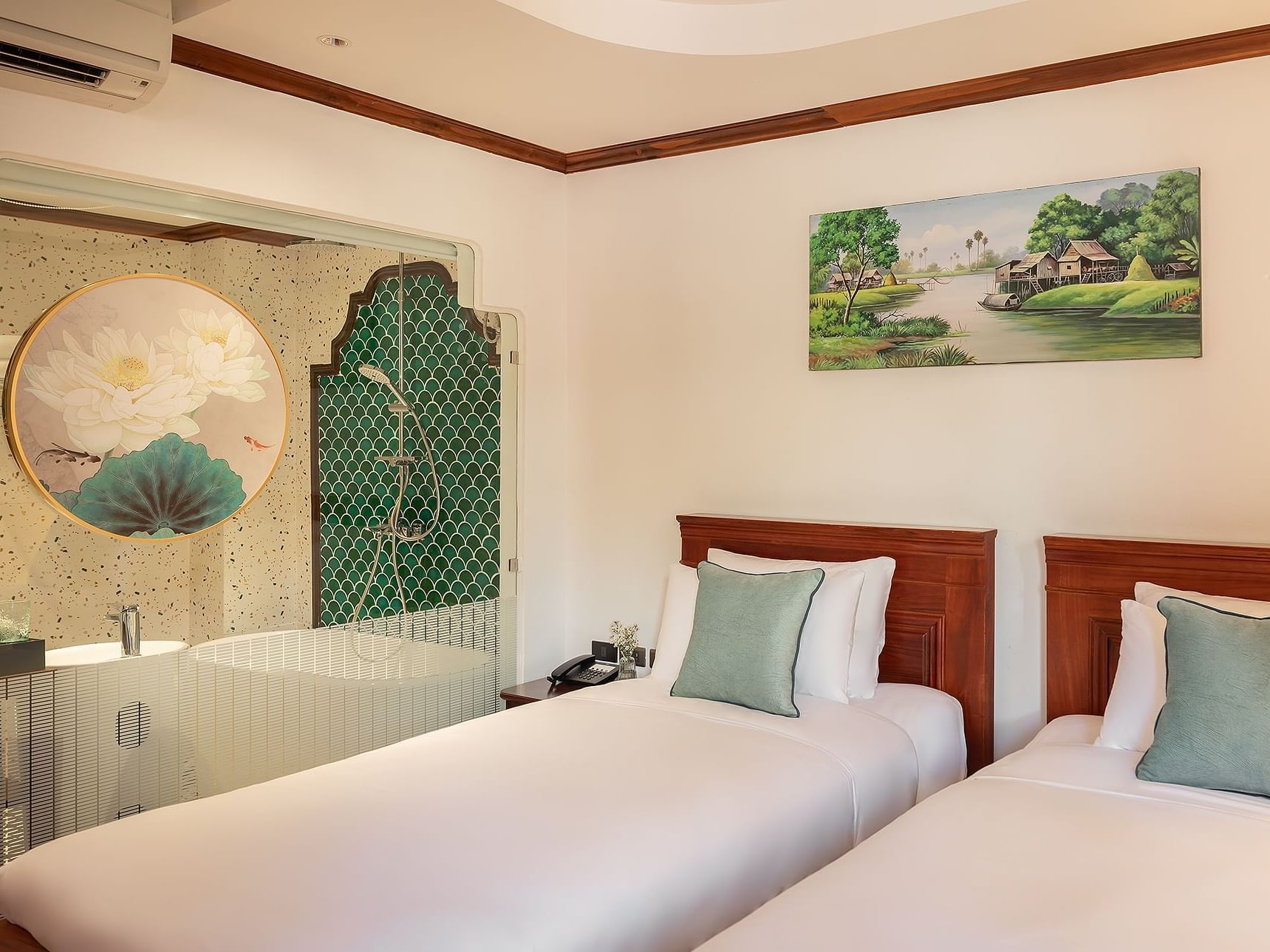 Two beds with bathroom area in Deluxe Garden View with Bathtub at U Luang Prabang