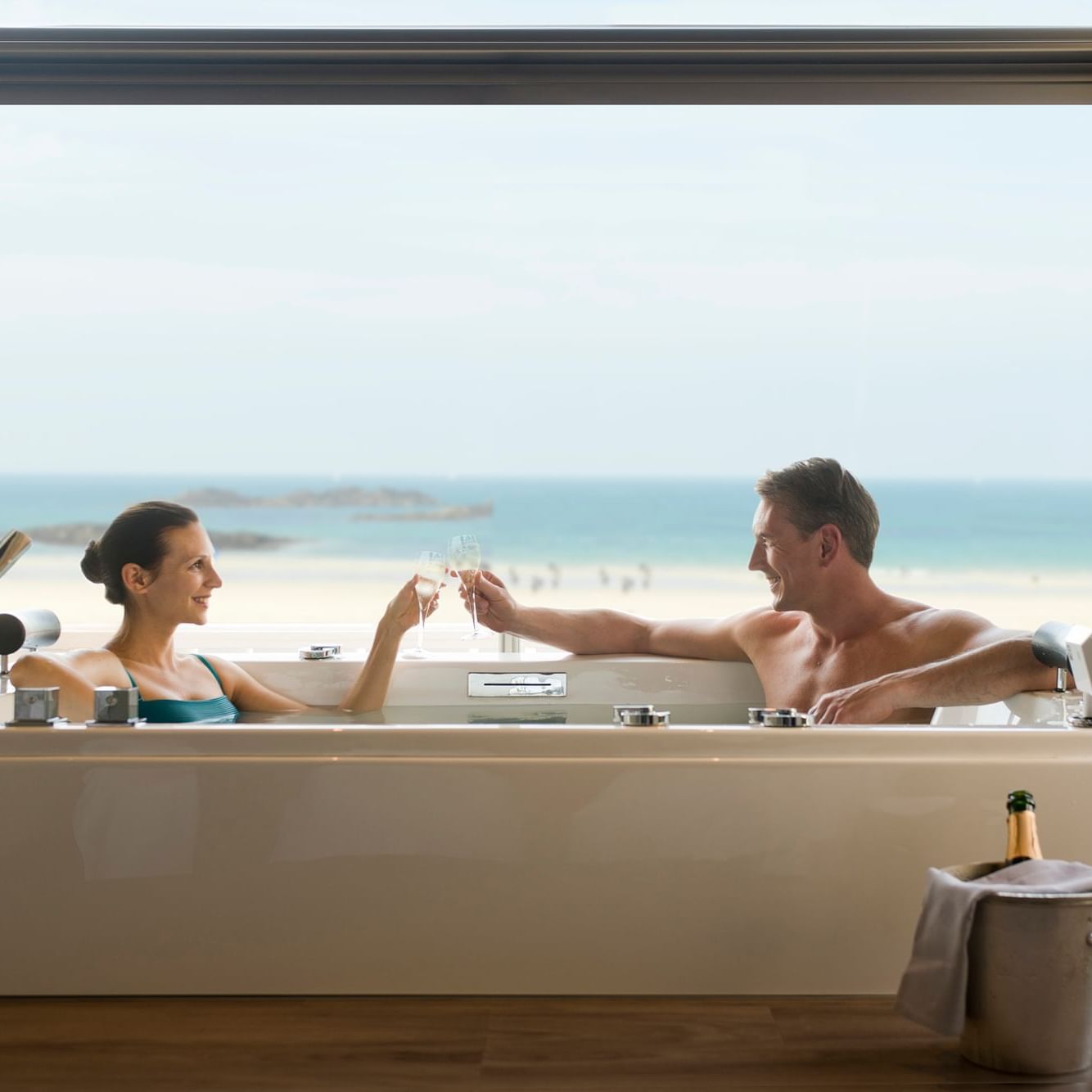 Couple enjoying a glass of Champagne at the Thermes of Saint Malo
