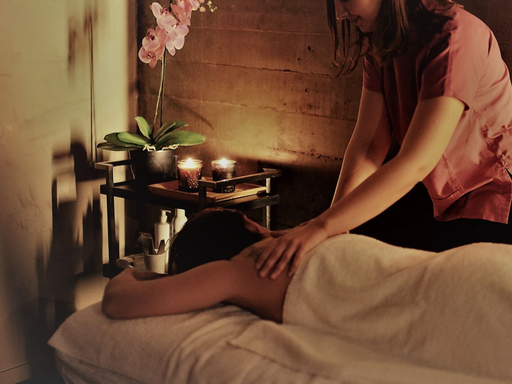 Lady enjoying massage, Oriental Spa, Duparc Contemporary Suites