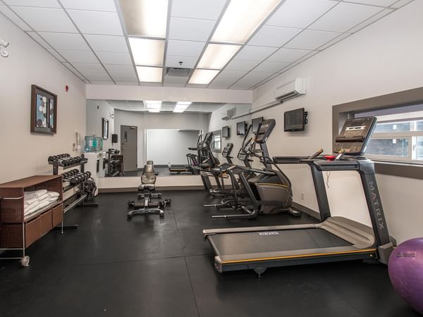 Fitness Centre with treadmill and weights.