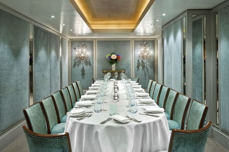Long set up dining table with glassware in Cadogan Suite at The Capital Hotel, Apartments and Townhouse