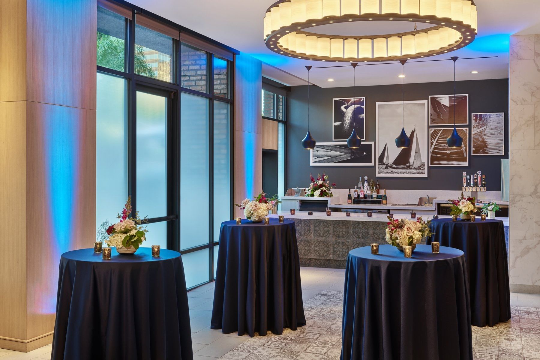 Cocktail tables arranged in an event space at Hotel Republic San Diego