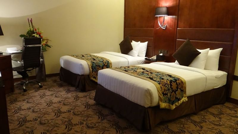 Club Suite beds at Al Hamra Palace by Warwick