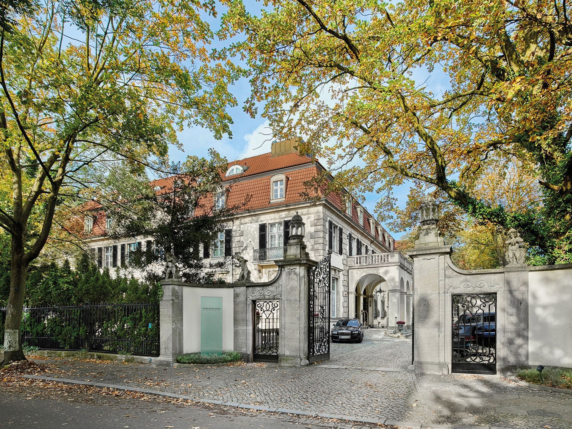 The exterior of the entrance at Patrick Hellman Schlosshotel
