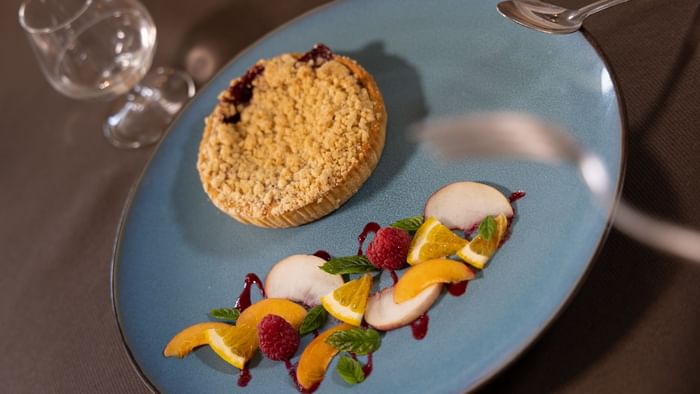 Crumble dish served in a restaurant at The Originals Hotels