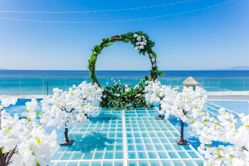 Beach area with wedding decorations at Playa Los Arcos