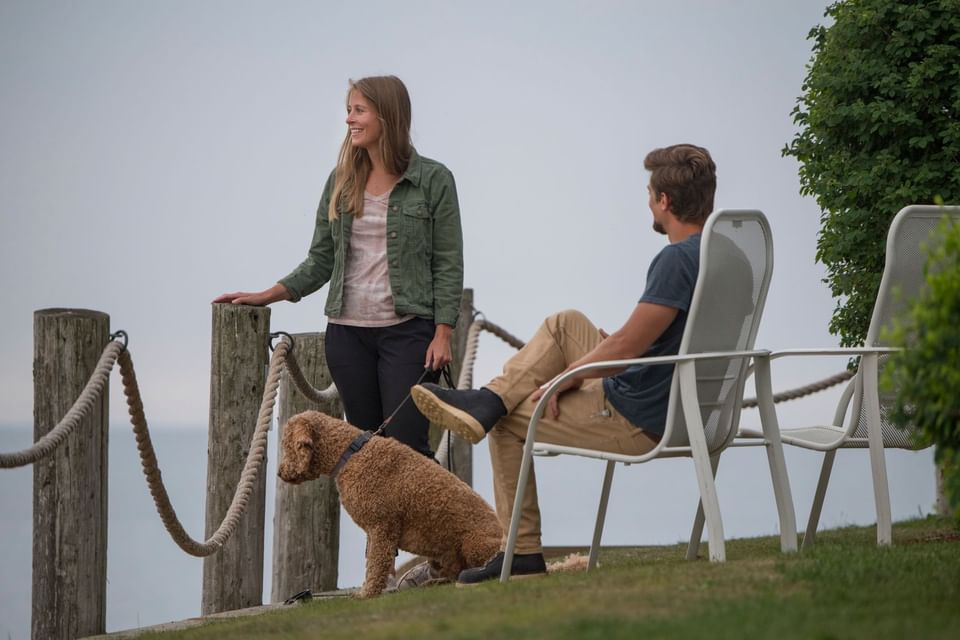 A couple with a dog at Bluefin Bay Family of Resorts