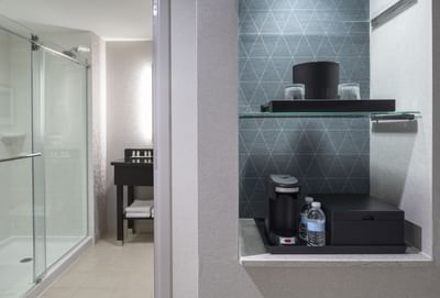 small shelves with coffee machine and ice bucket