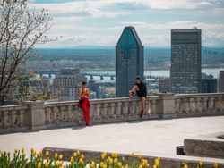 A couple by the balcony in Mont Royal near Le Cantlie Suites