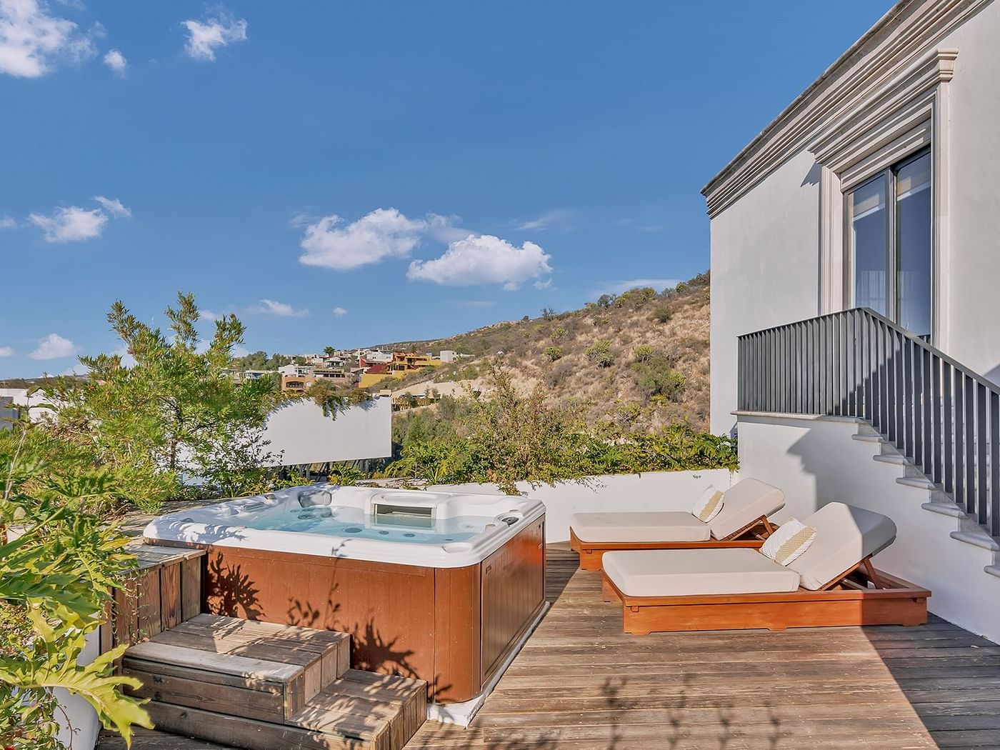 Private Jacuzzi with sun beds in a spacious balcony area at Live Aqua Resorts