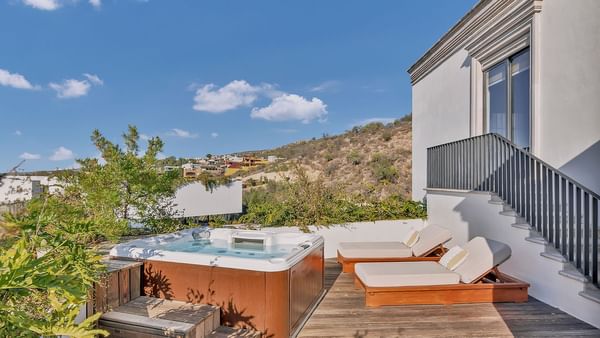 Private Jacuzzi with sun beds in a spacious balcony area at Live Aqua Resorts