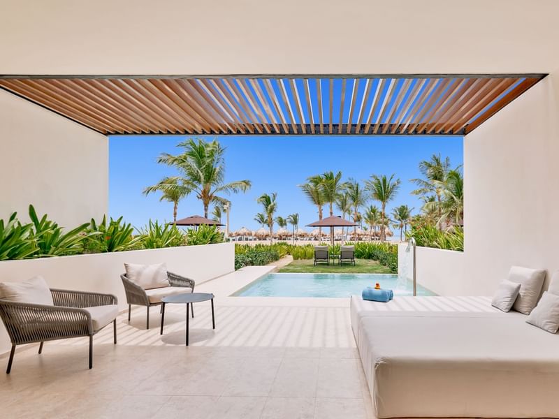 Outdoor pool with lounge area in Tierra Suite at Live Aqua Punta Cana
