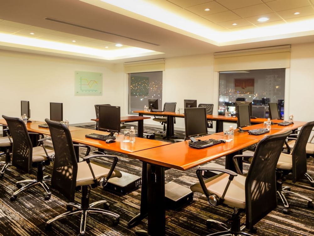 U shaped table setup with computers at Fiesta Inn Hotels