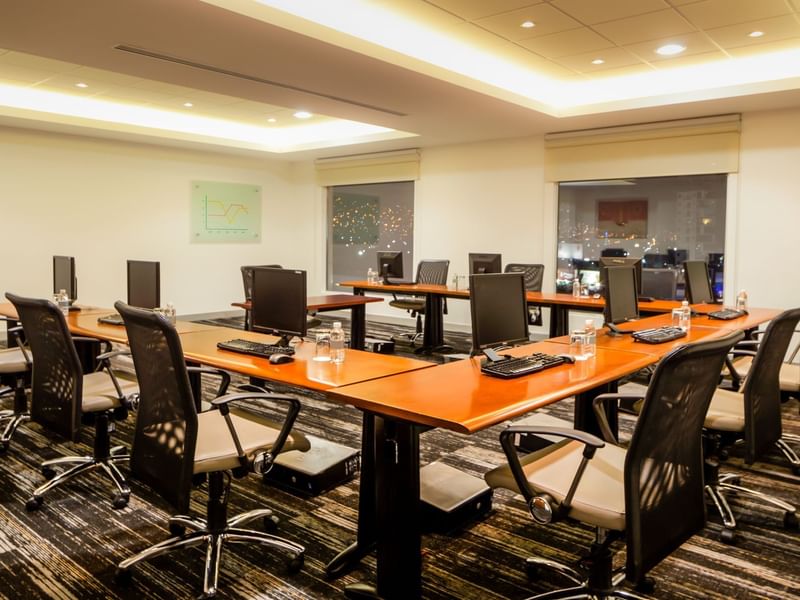 U shaped table setup with computers at Fiesta Inn Hotels