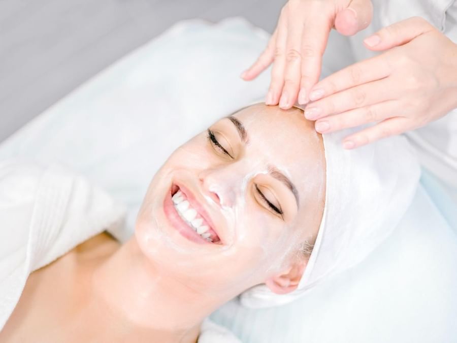 Lady having facial treatment in spa at Grand Fiesta Americana