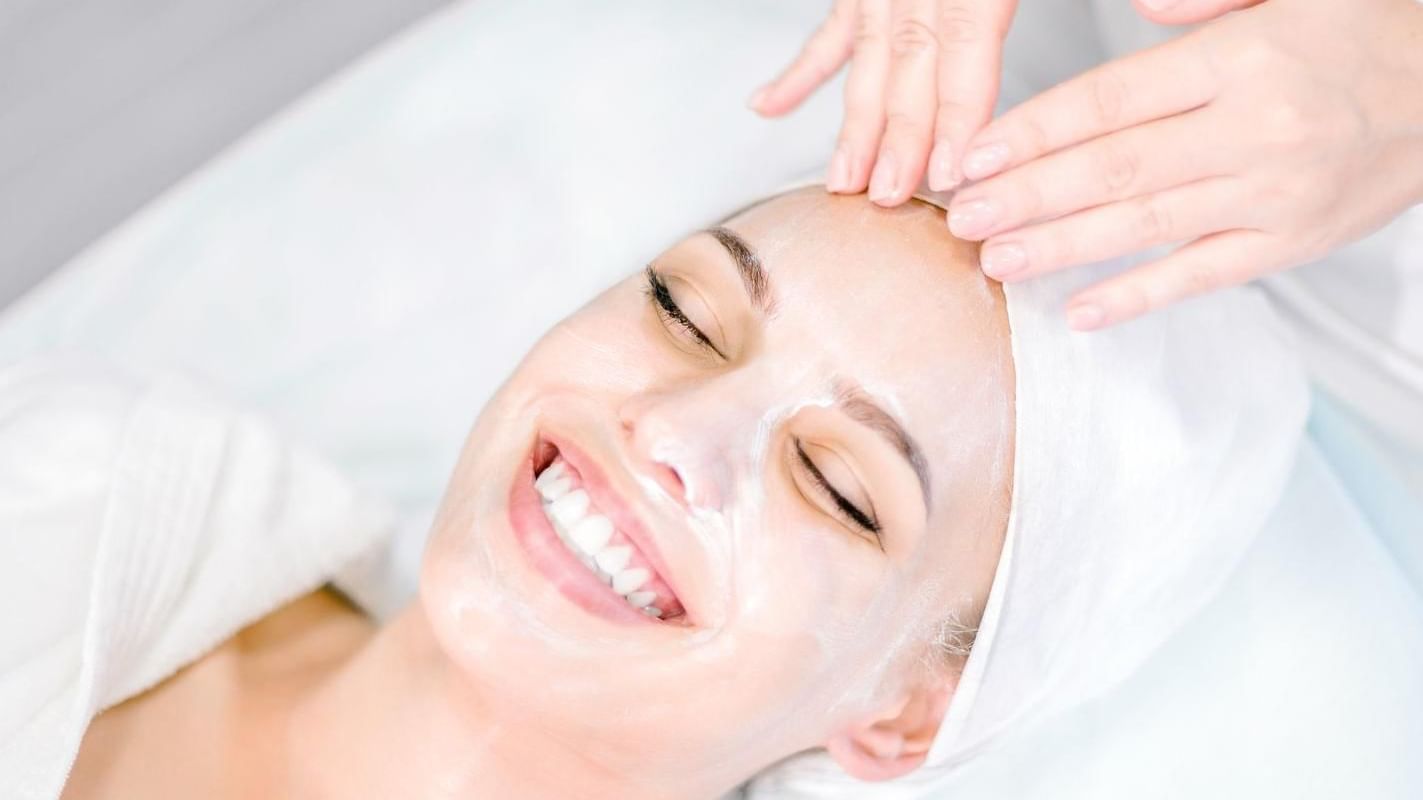 Lady getting a facial from the spa at Grand Fiesta Americana