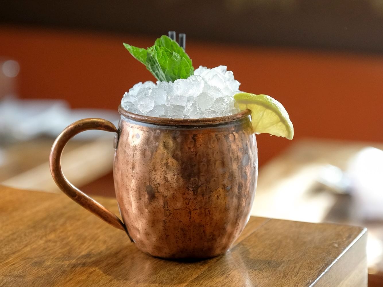 A copper glass filled with ice on a table at Boulan South Beach