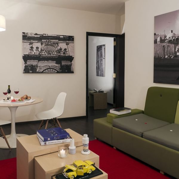 Living area with dining table in Junior Suite at Fiesta Inn