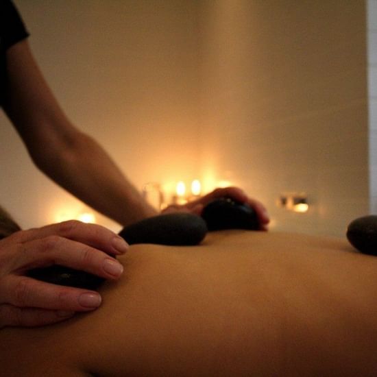 Female receiving back massage at Pullman Palm Cove Sea Resort