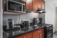 Our fully stocked kitchens include microwave, Keurig coffee machine, oven and more