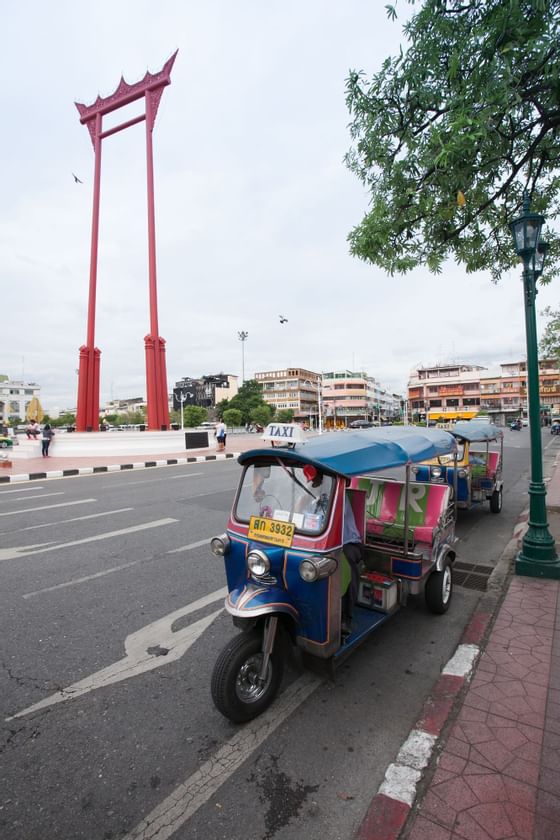 Three wheelers parked near Maitria Hotels & Residences