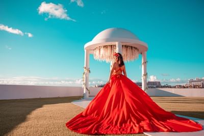 Lady in a red dress outdoors at The Morgan Resort Spa Village