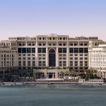 Exterior view of hotel by a river at Palazzo Versace Dubai