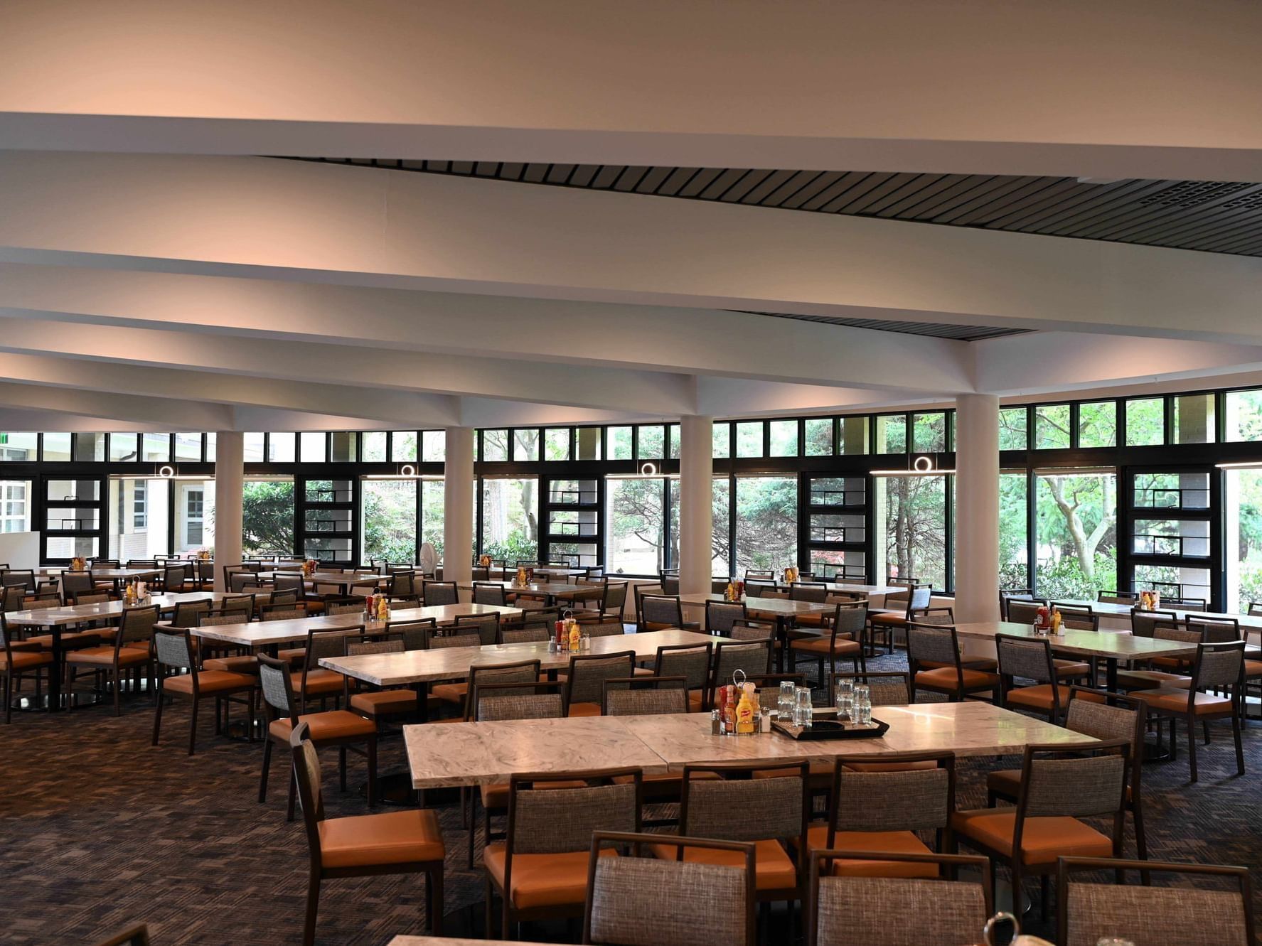 Dining area with many tables and chairs at Osgood’s Restaurant, Bolger Center.