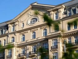 Exterior view of Polonia Palace Hotel with balcony on a sunny day
