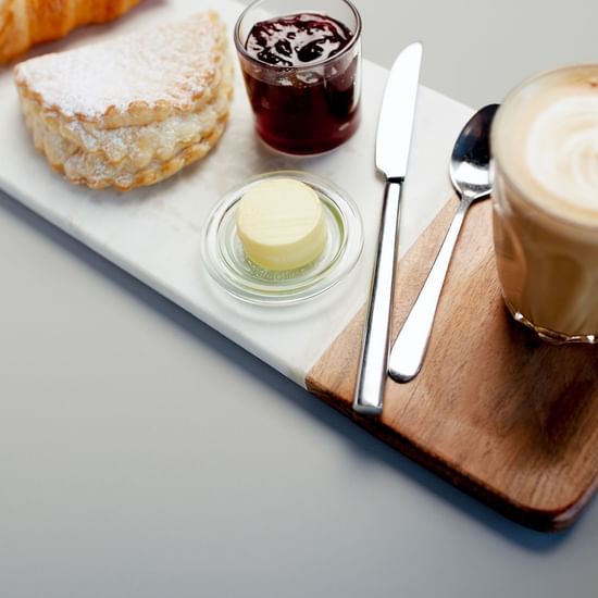 Buns and cappuccino served at Pullman Albert Park