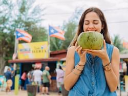 woman holding coconut