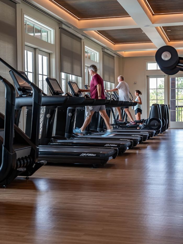 People exercising on treadmills in the Camp Creek Wellness Center in Inlet Beach.