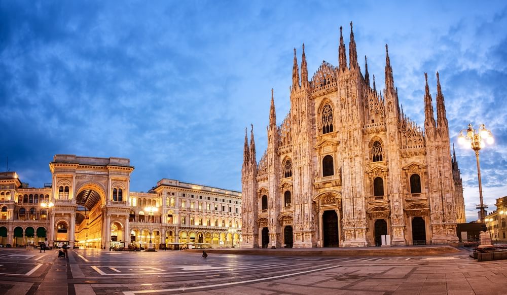 Wide view of Milan Cathedral by the Galleria Vittorio Emanuele II near the Palazzo Parigi Hotel