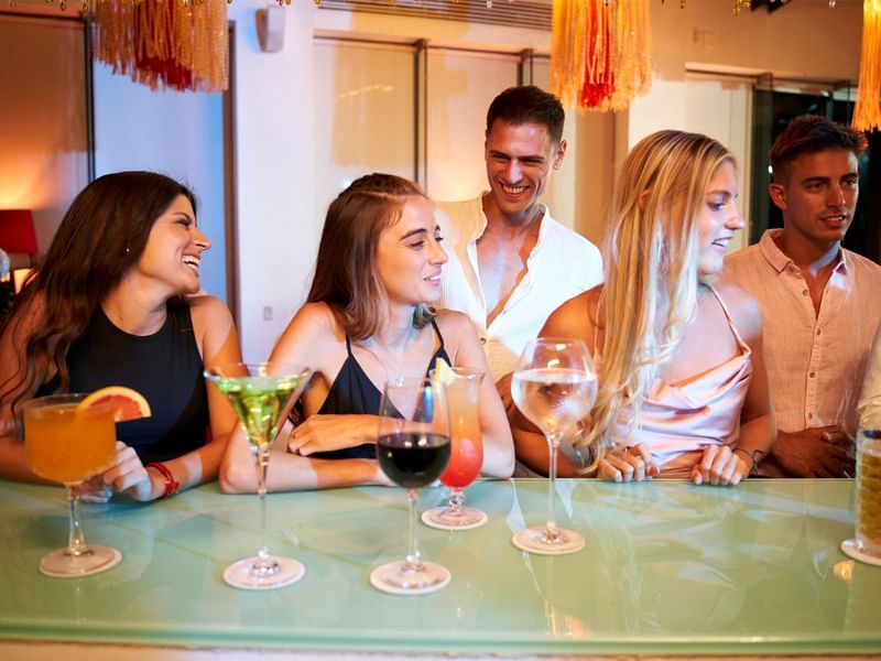 People enjoying their cocktails in the bar at Fiesta Americana