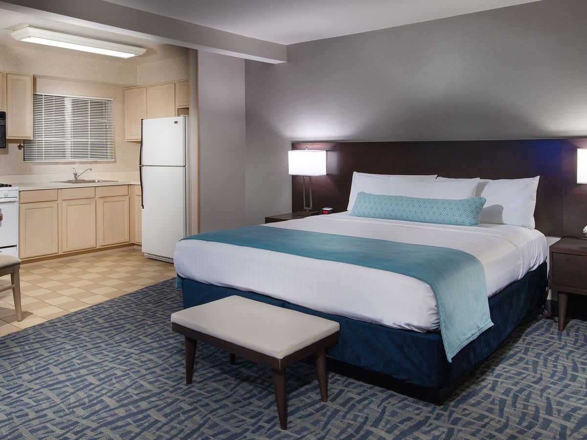 A Coast King Junior Suite bedroom and kitchenette