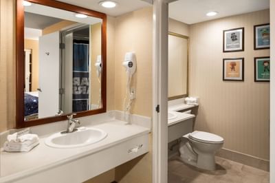 Bathroom vanity with a lavatory in Suite at Anaheim Portofino Inn, a Disneyland area hotel with renovated family suites 