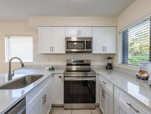 Kitchen with appliances in Two Bedroom Premium at Legacy Vacation Resorts