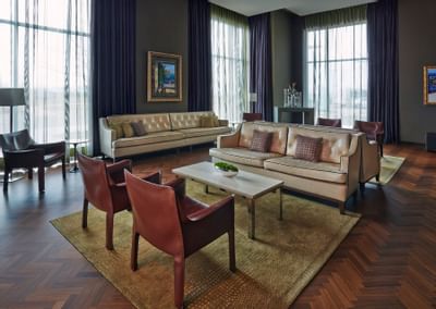 couches and chairs in a hotel room